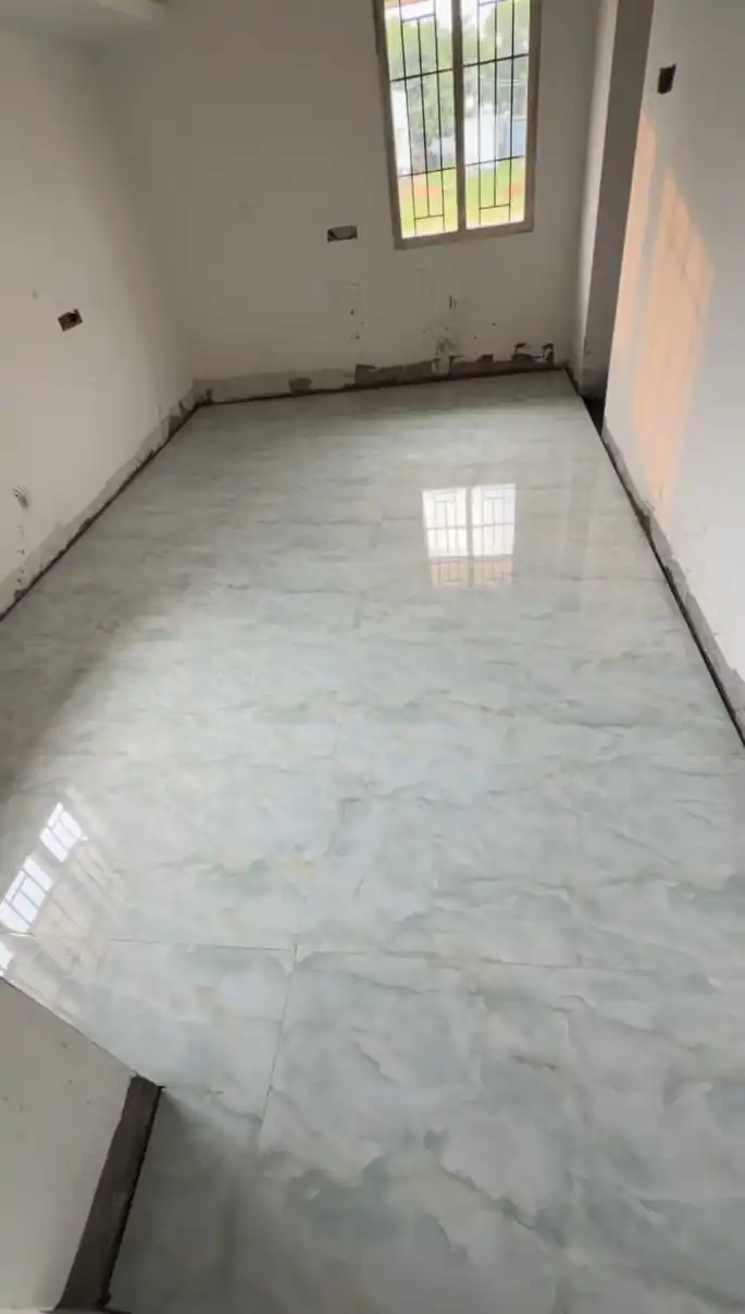Living room vitrified tiles flooring installation in Lucknow residential interior